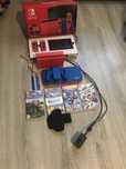 Nintendo Switch Mario Red & Blue Edition + 4 gry + opaska na noge
