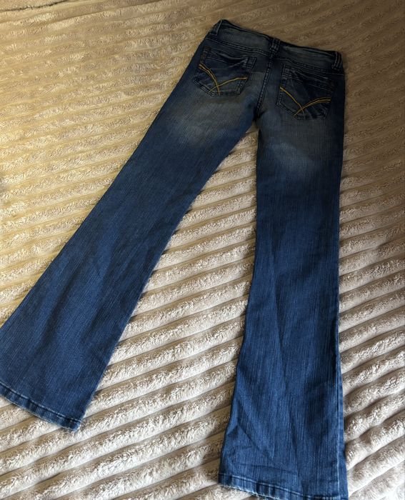 Вінтажні Джинси кльош з низ. посадкою розмір с