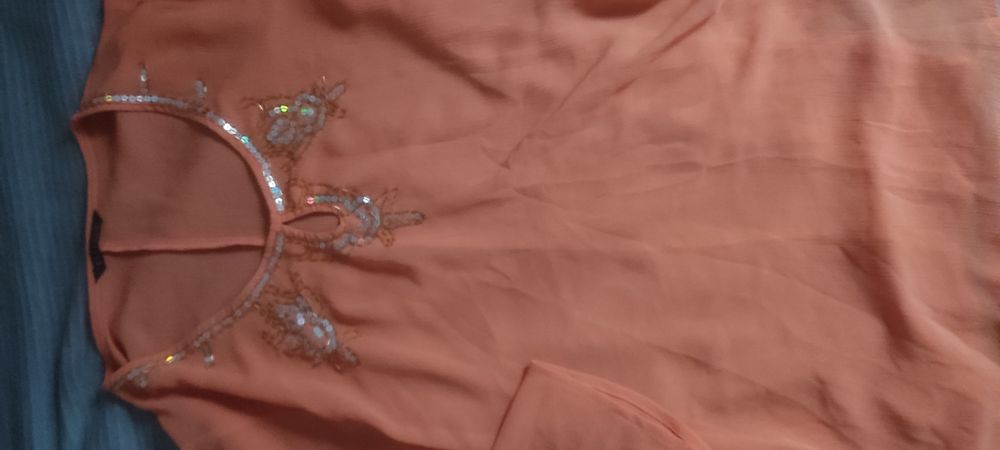 Pomarańczowa bluzka z cekinami