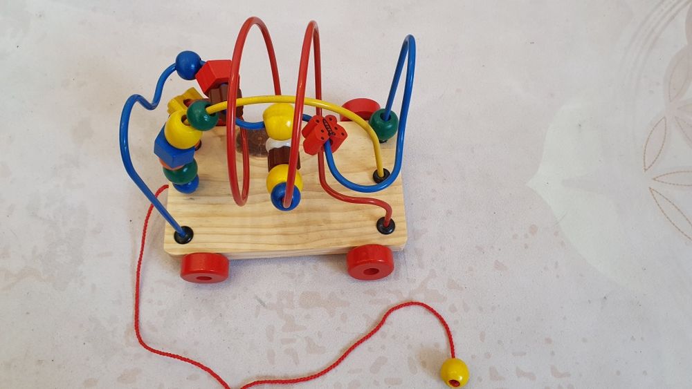 іграшка каталка-головоломка