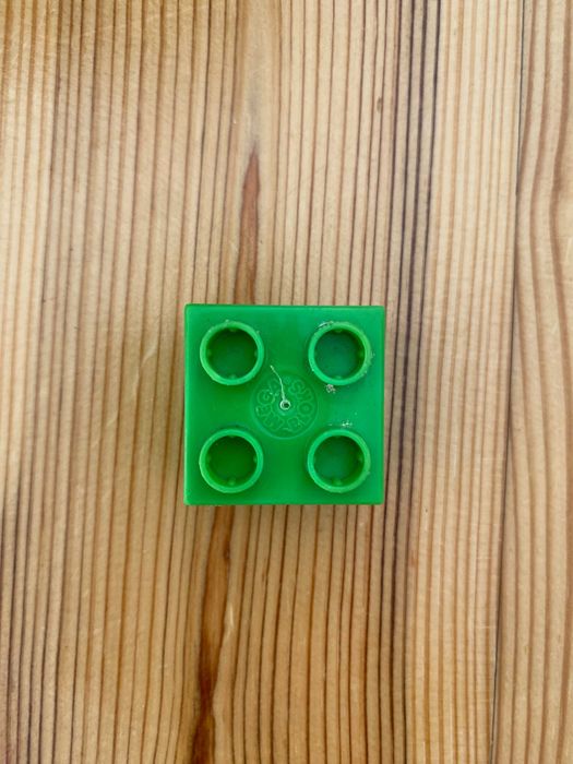 Pojedynczy, zielony klocek MEGA