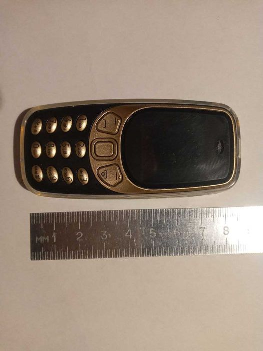 Кнопочный мини телефон на 3 сим.