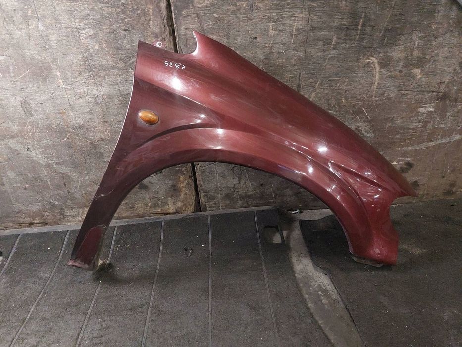 BŁOTNIK PRAWY PRZÓD CHRYSLER  VOYAGER IV