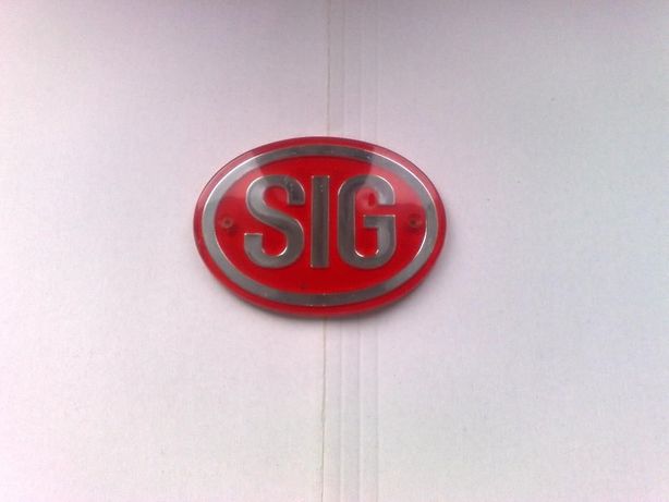 Logo SIG , nowe kolor czerwono-srebrny .kształt owalny - Kolecjonerska