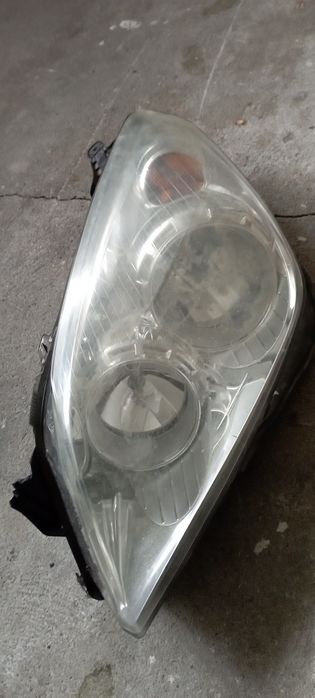 Lampa Opel Astra H lewy przód
