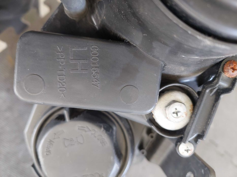 farol esq Chevrolet captiva