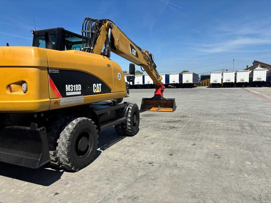 Wypożyczalnia, wynajmę- Koparka kołowa obrotowa CAT M318D