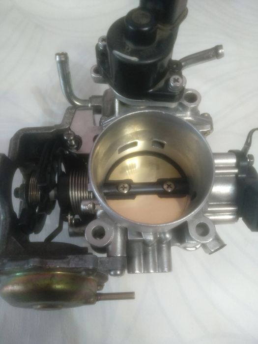 Продам дроссельную заслонку  Митсубиси Pajero.   Оригинал !