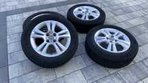 Koła felgi aluminiowe Opel Corsa D 4x100 15 cali opony całoroczne