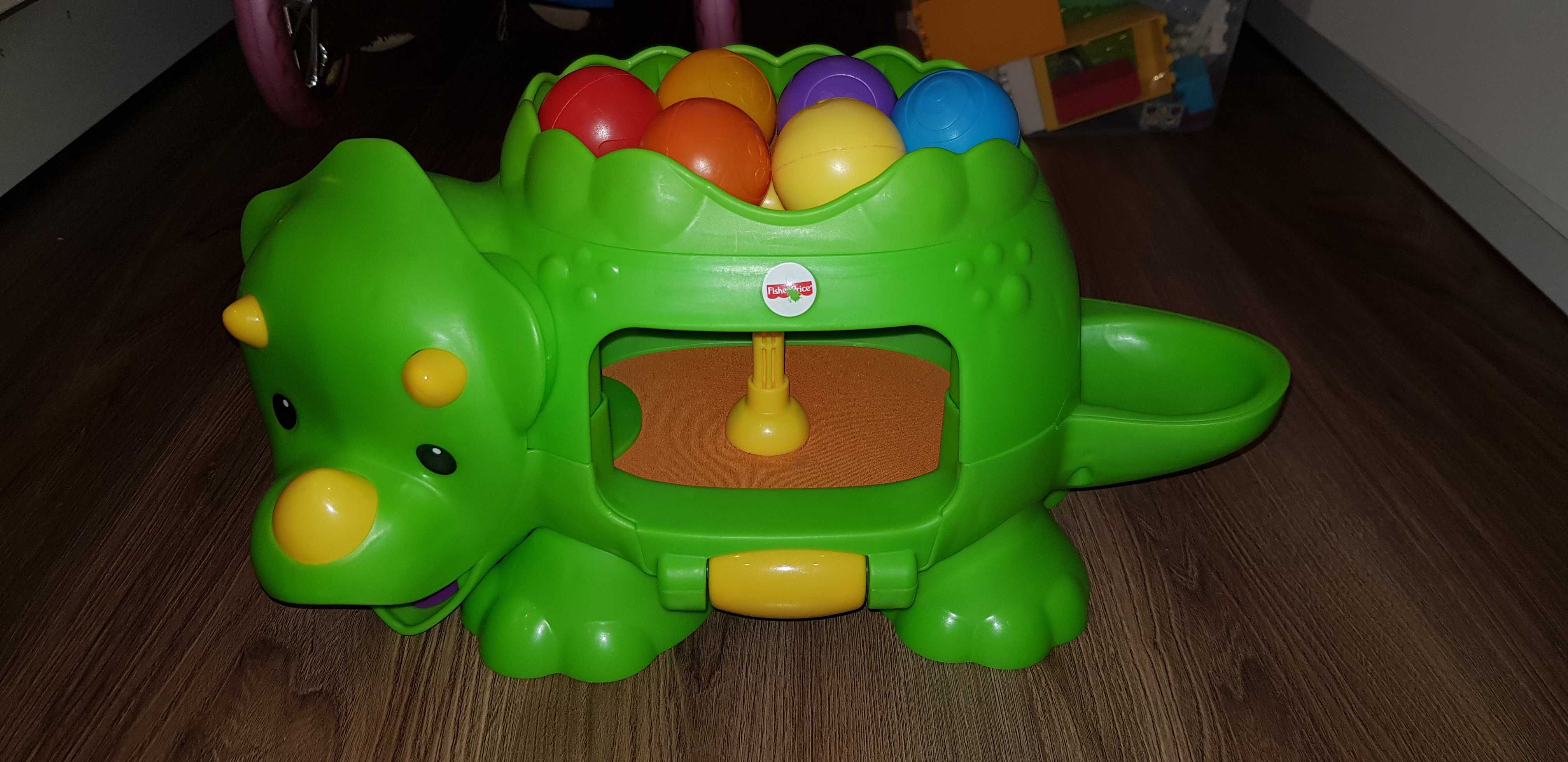 Fisher Price Dinozaur z piłeczkami skaczącymi.