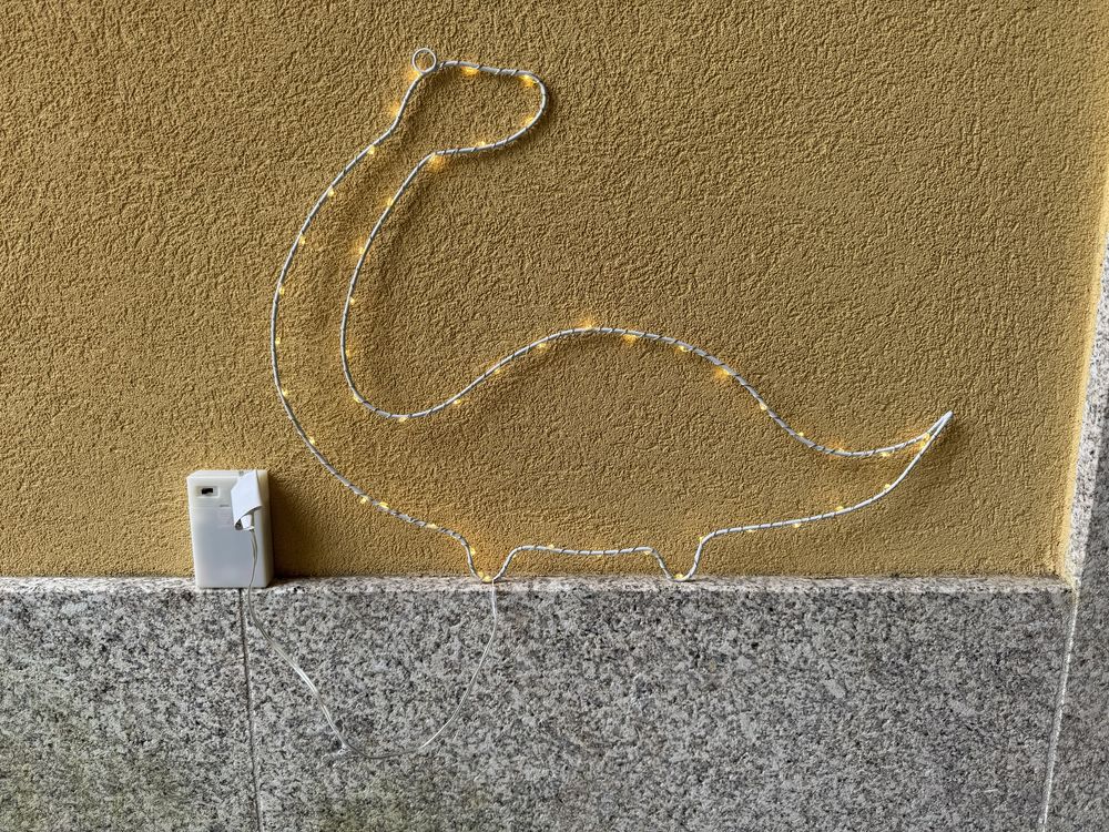 Forma dinossauro em luz para parede do quarto