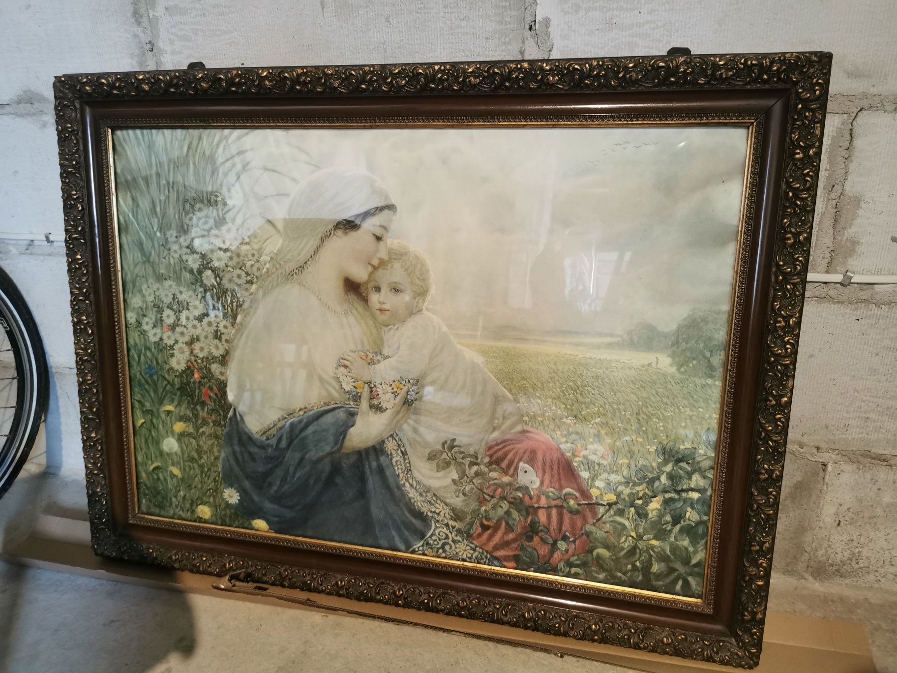Stary obraz w zdobionej pozłacanej ramie