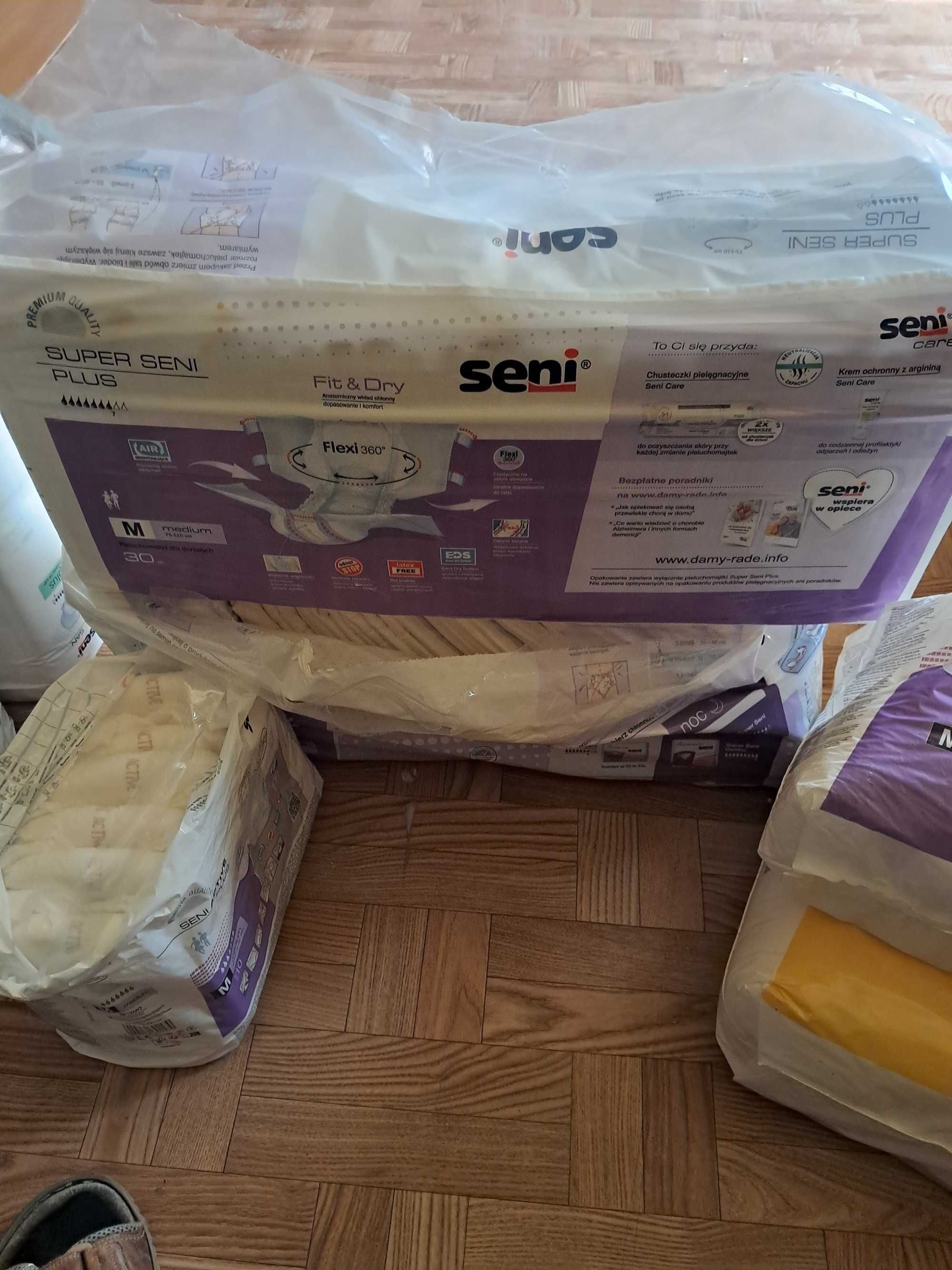 Pampersy, pieluchomajtki, wkłady do pampersów i podkłady.