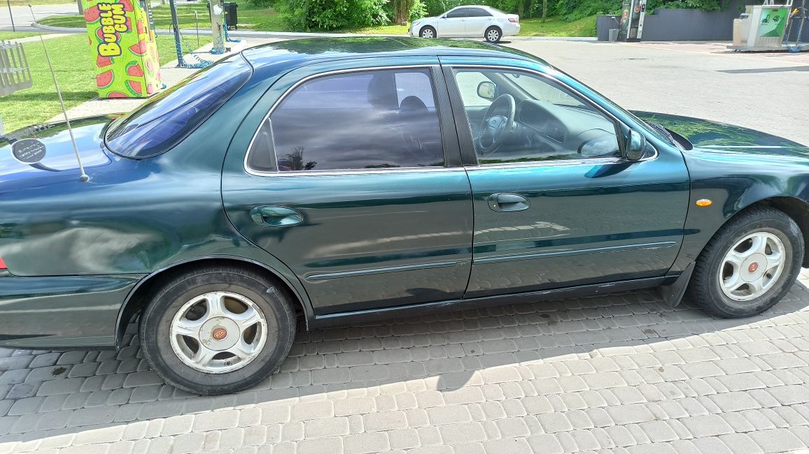Автомобиль киа кларус