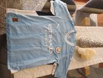2 camisolas de futebol uma fo Manchester city e outra do Real Madrid