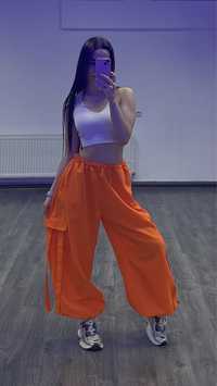 оранжеві штани для танців