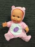 Boneca bebe que canta e mexe