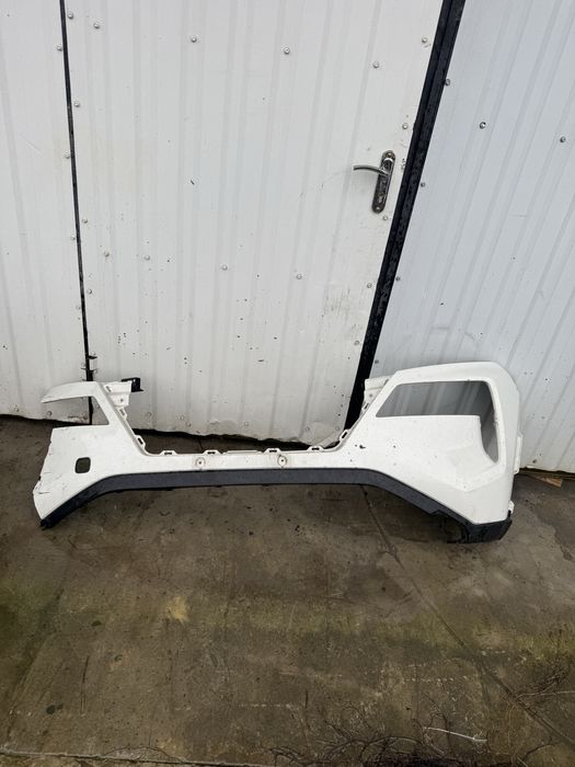 Передний бампер Nissan Rogue T33 дорест левая часть