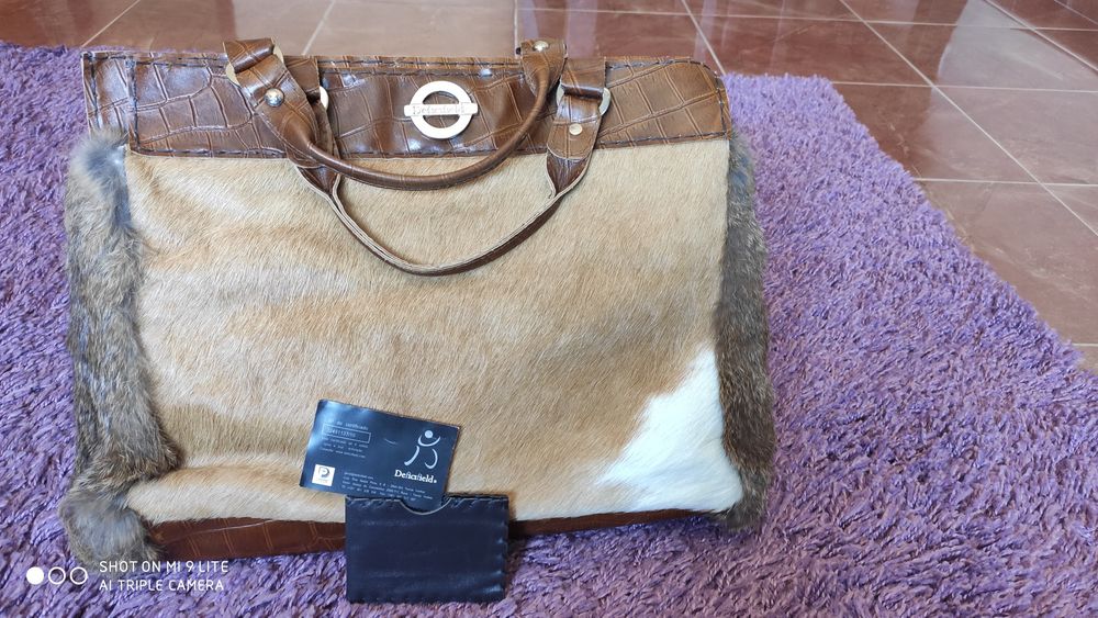 Mala/carteira em pele