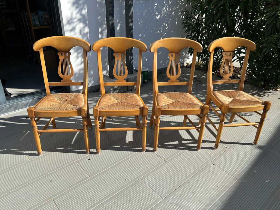 Four vintage dining room table chairs.