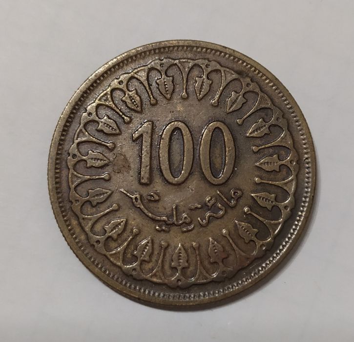 Продам монету 100 миллимов
