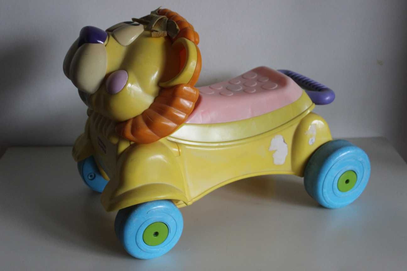 Fisher Price - Pchacz wózek jeździk grający lew