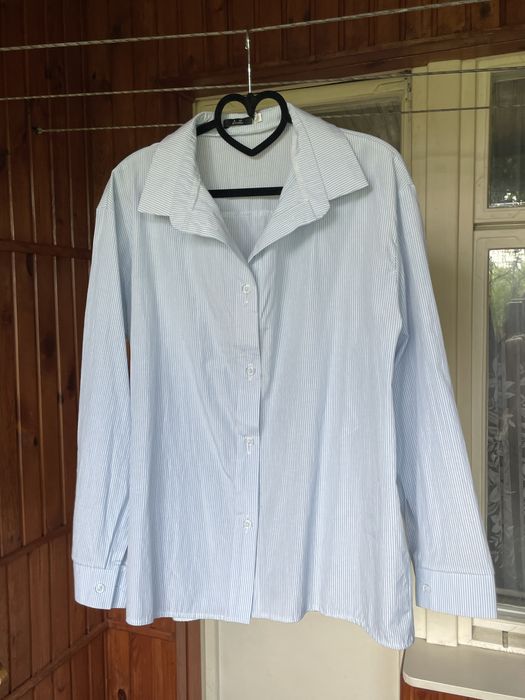 Блакитна рубашка в смужку