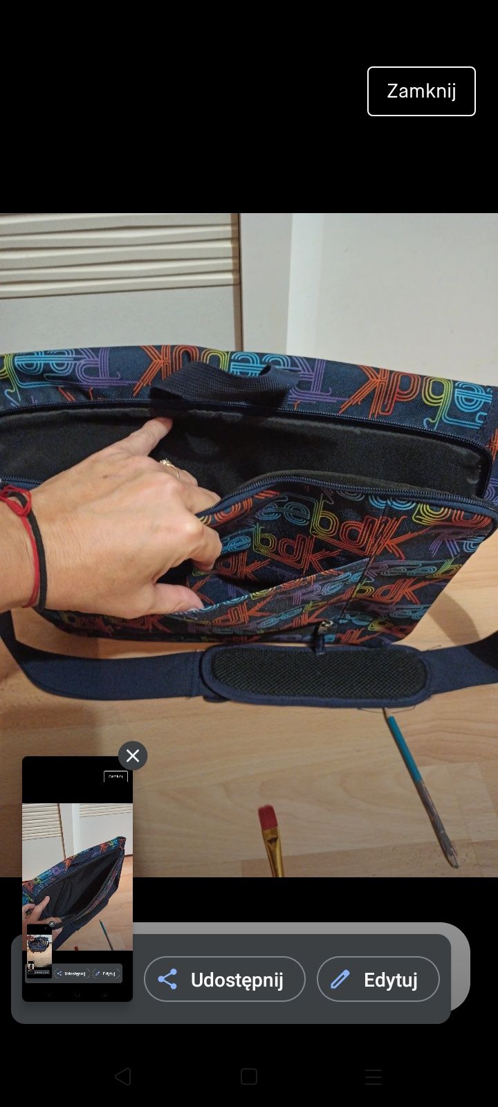 Torba na laptopa oraz książki