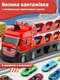 Іграшка велика вантажівка з машинками та катапультою
