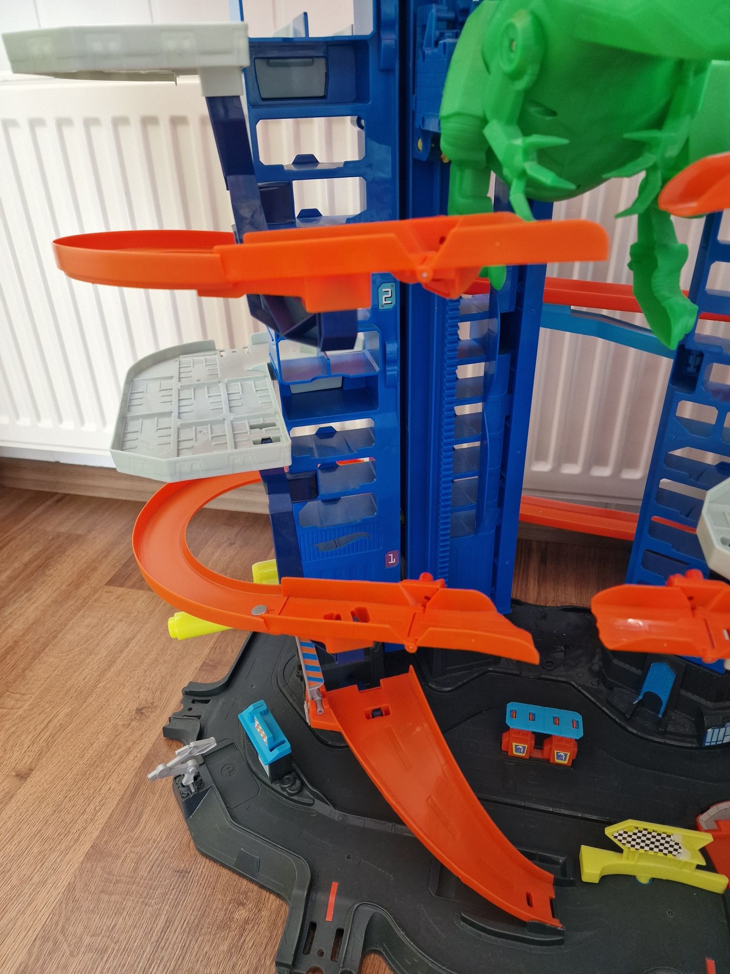 Garaż dla aut Hot Wheels City Mega Garaż T-Rexa GJL14