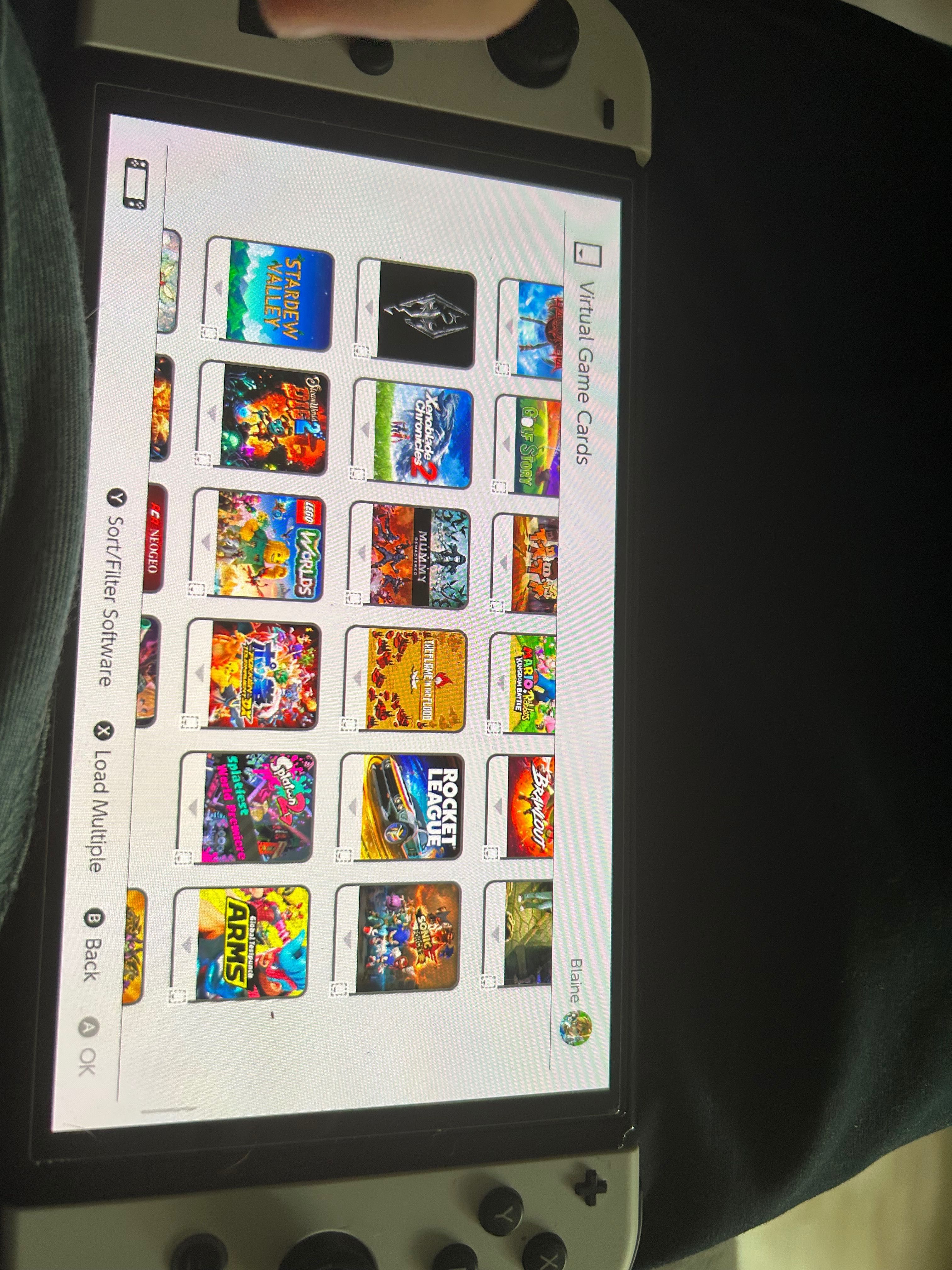 Nintendo Switch OLED + 3 gry w pudełku i 225 gier cyfrowych