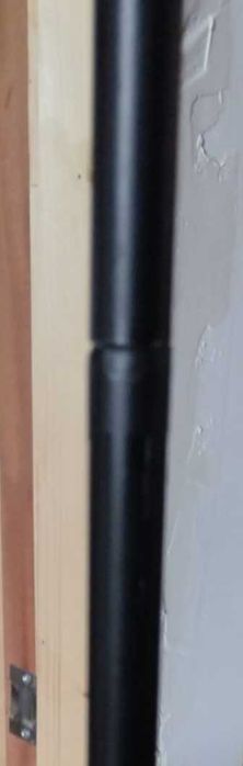 Wood and metal clothes hanging rail