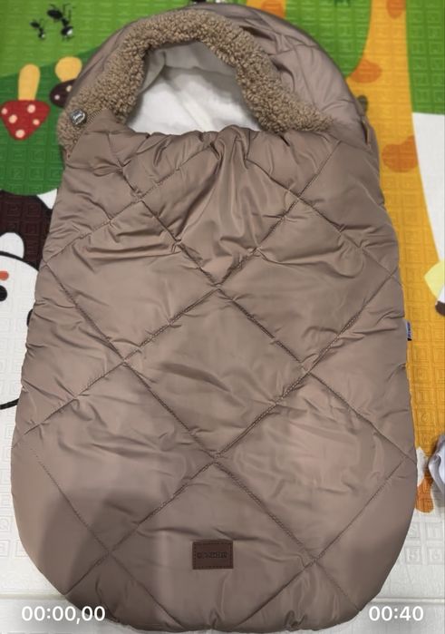 Конверт -кокон зимовий,ціна на сайтах от 1500 до 2000