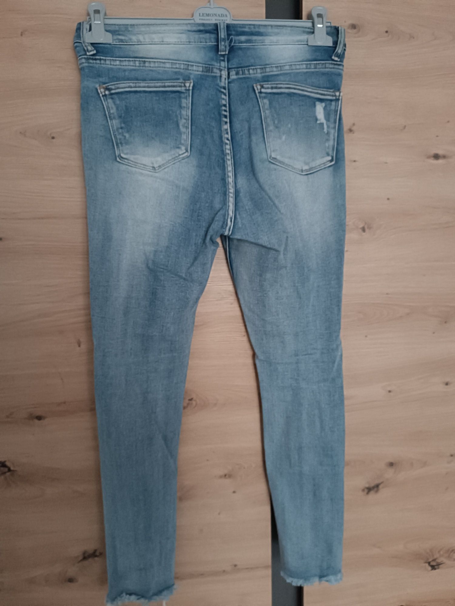 Spodnie damskie jeansy rurki przetarcia L