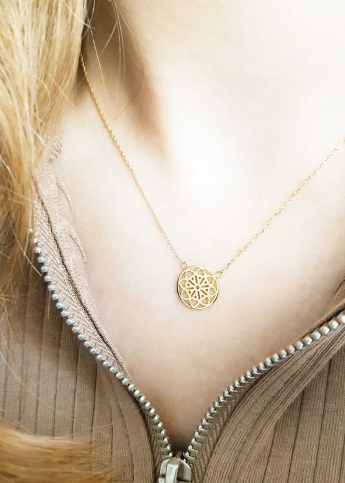 Złota celebrytka z ażurowym kółkiem z kwiatowym wzorem pr. 585