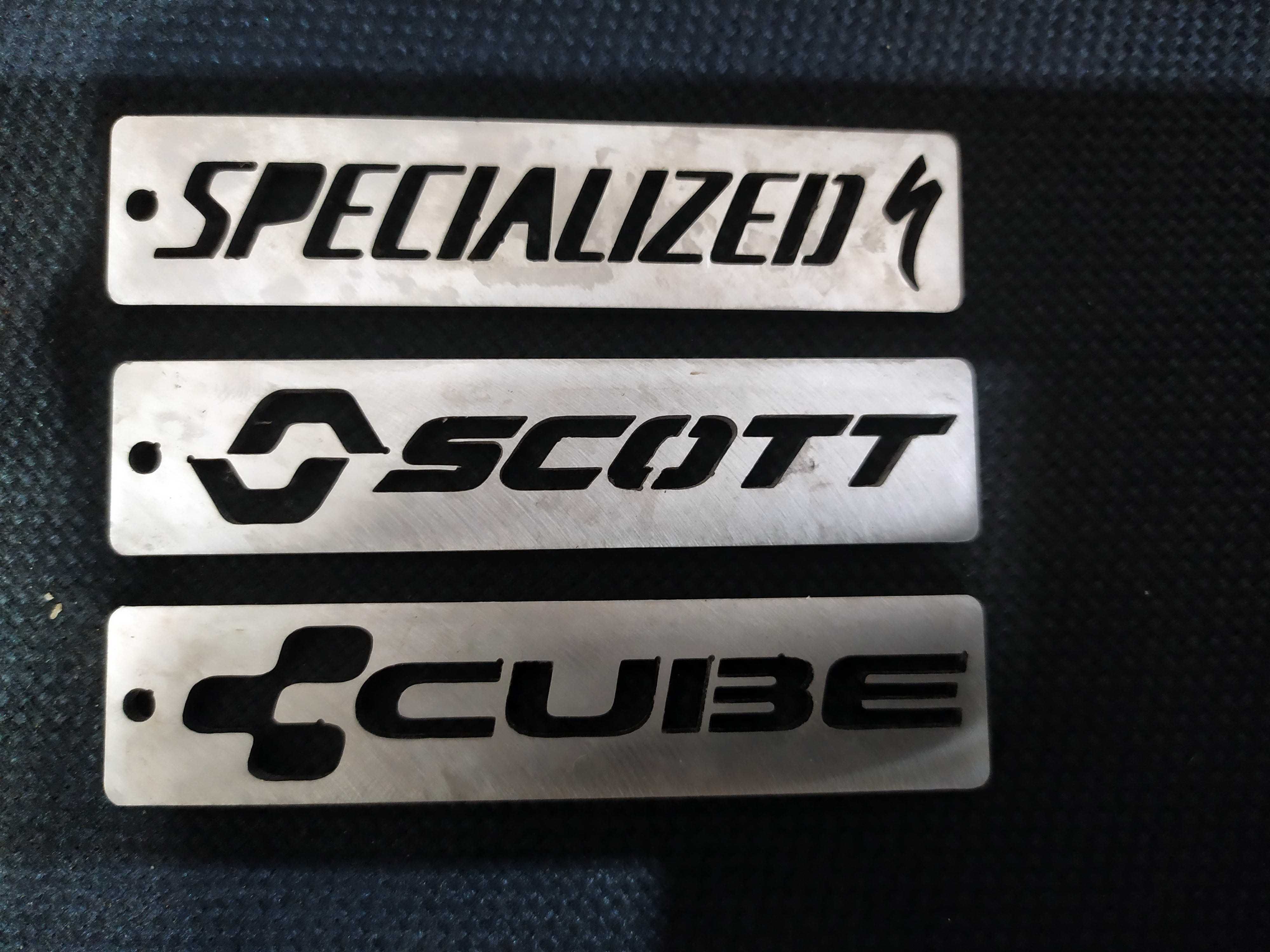 Брелки с логотипами Chevrolet , Daihatsu, Mopar, Scott, Specialized ..