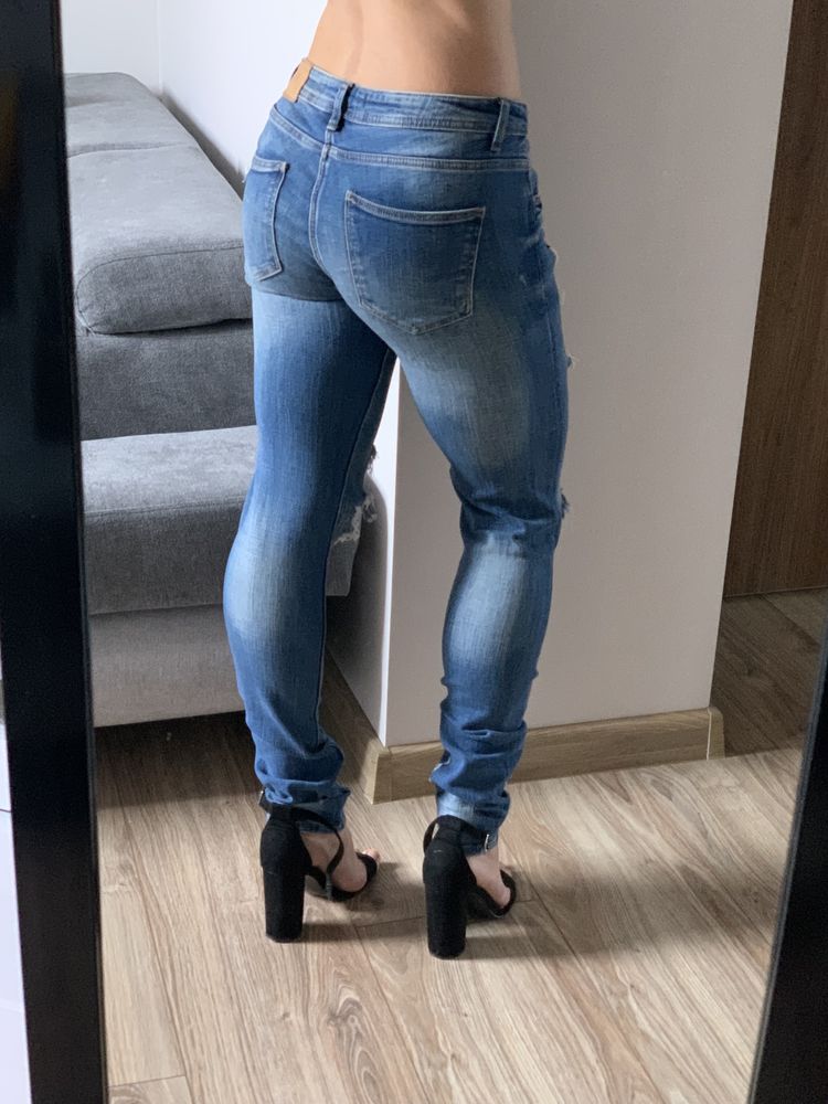 Spodnie jeansy z przetarciami Zara S 36