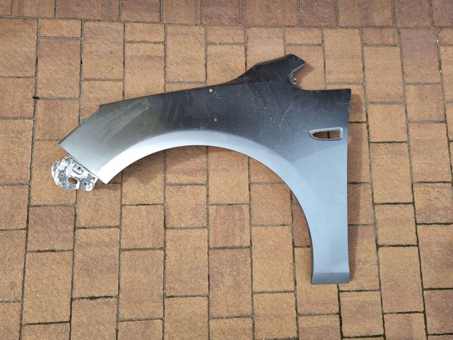 Opel astra 4 IV j 09  15 błotnik lewy przód oryginał