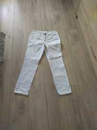 Idealne białe spodnie damskie z laycrą - rurki r.M