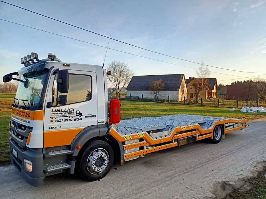 Pomoc drogowa transport maszyn laweta autolaweta usługi transportowe