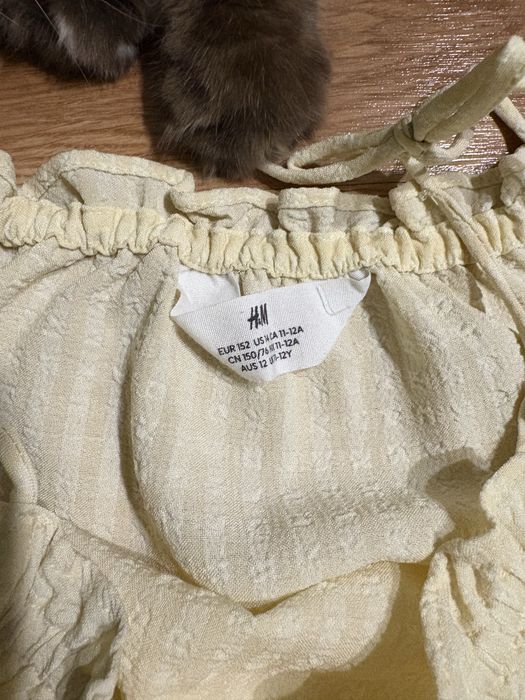 H&M kombinezon dziewczęcy żółty wiązany lato krótka nogawka 152