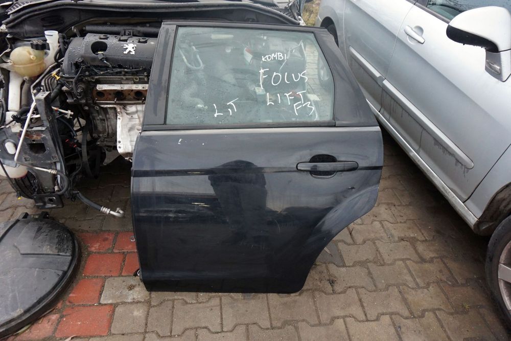 DRZWI TYLNE LEWE FOCUS II MK2 LIFT KOMBI F3  CZARNY PANTHER FORD 2008-2011