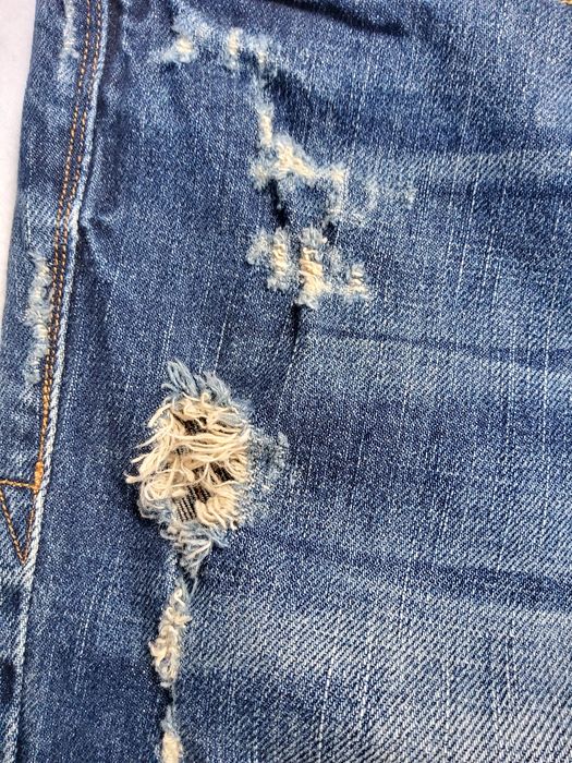 Guess - męskie spodnie jeansowe z dziurami i przetarciami